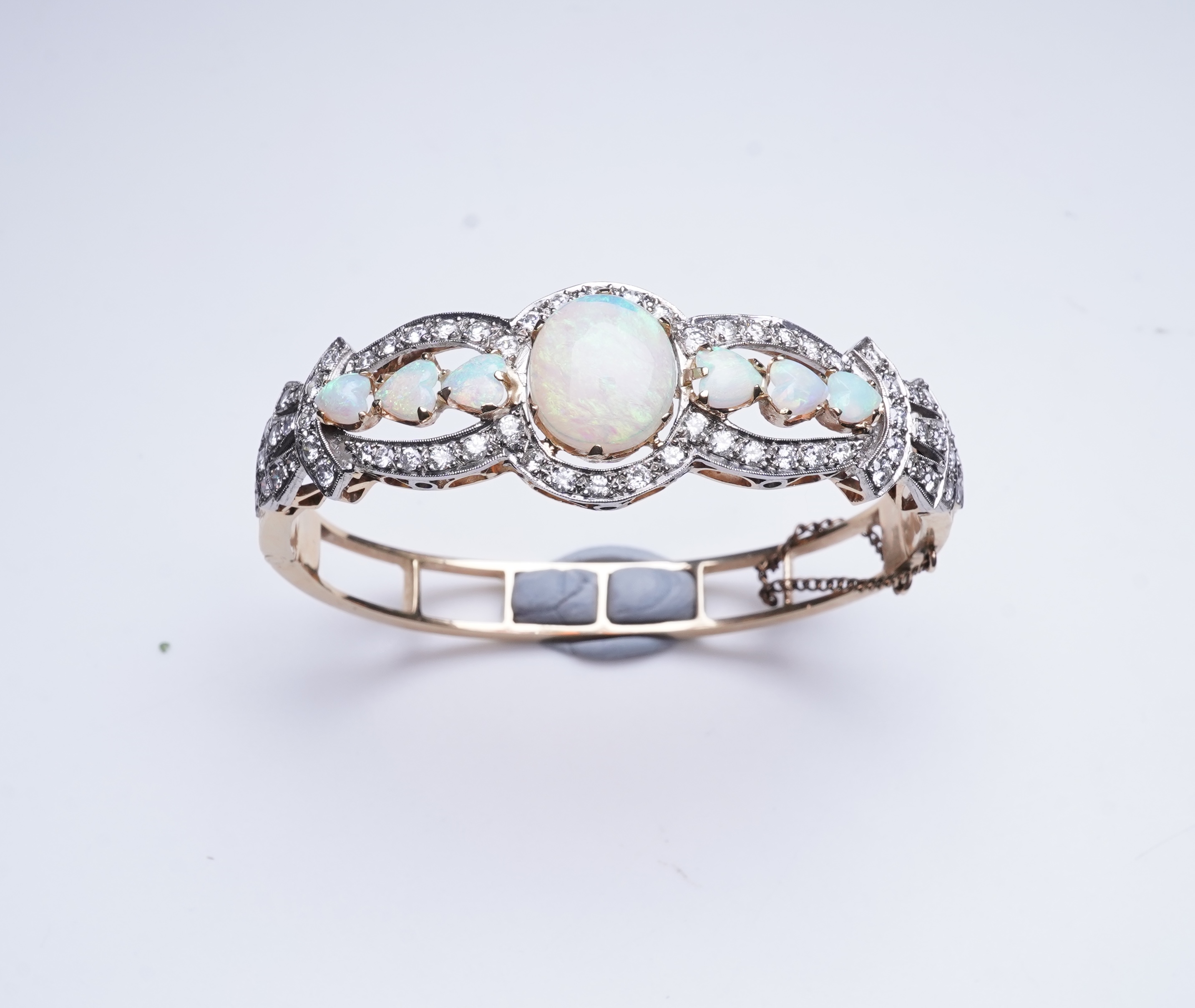 An opal and diamond bangle